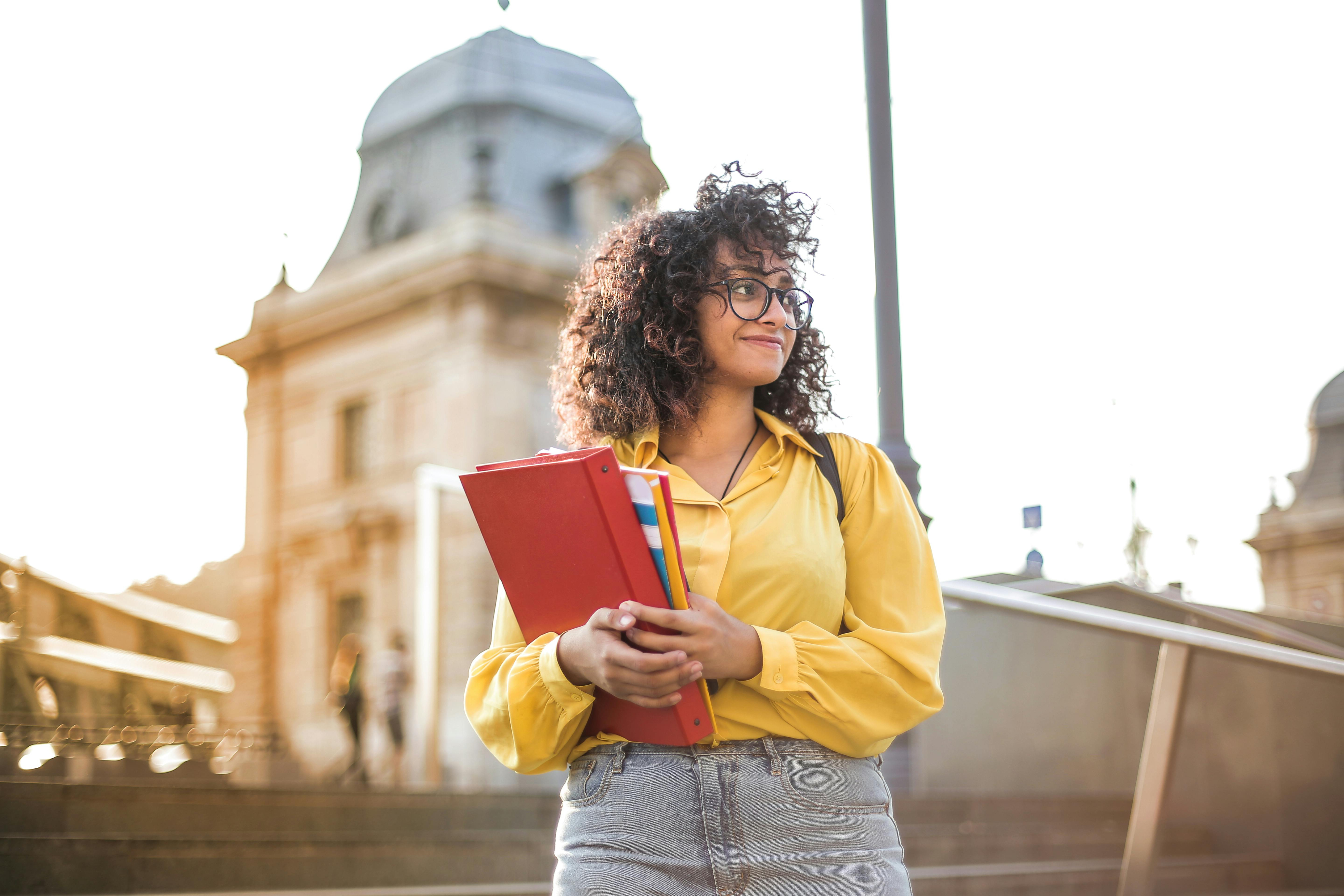 Student holding books